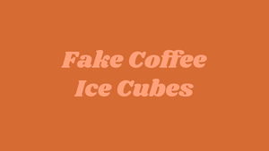 Big Heart Tea Co.'s organic herbal blend Fake Coffee as ice cubes, with a reusable straw, a reusable cup, and a reusable gold spoon